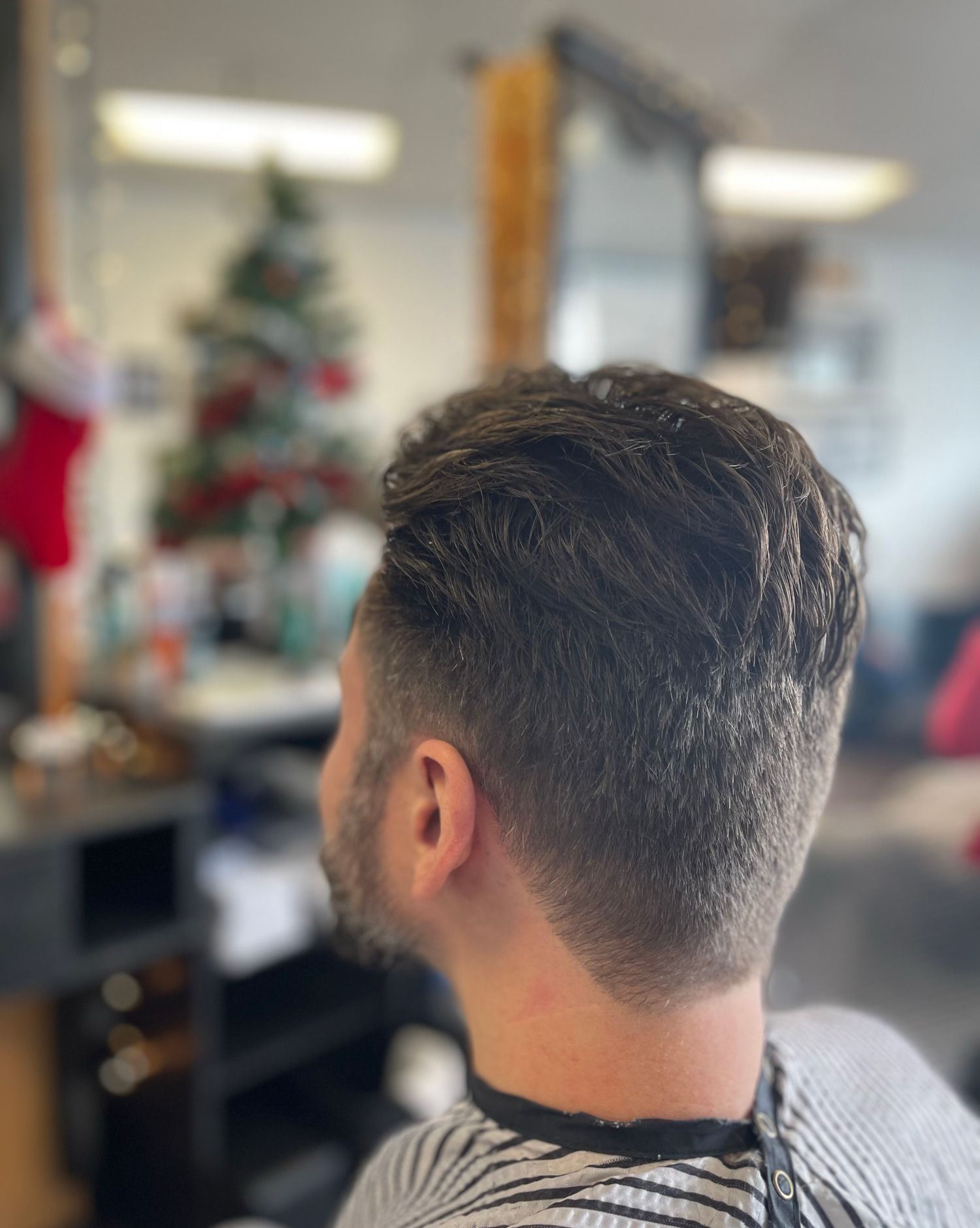 Clean textured fade haircut at Back To Barbering
