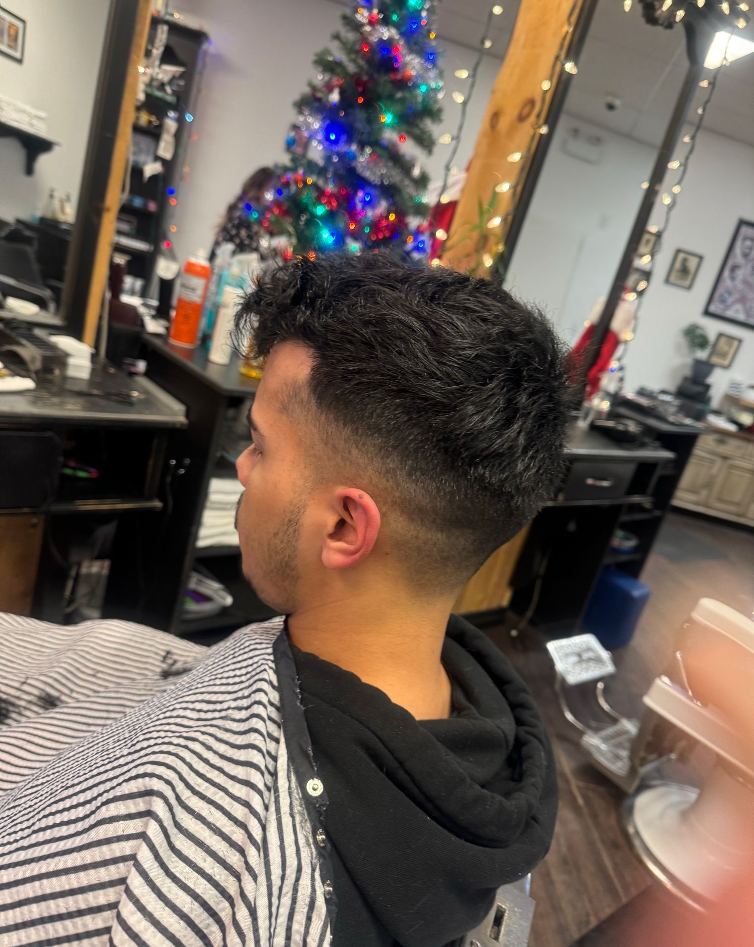 Clean textured fade haircut by Back To Barbering